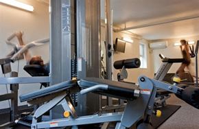 Winnipeg apartment for rent - a man is working out in a gym with weights