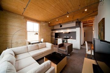Winnipeg apartment for rent - a living room with a white couch and a table