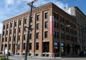 Winnipeg apartment for rent - a large brick building on the corner of a street