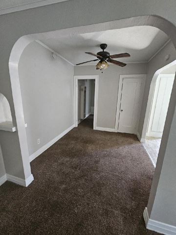 San Bernardino apartment for rent - a living room with a ceiling fan and a carpet