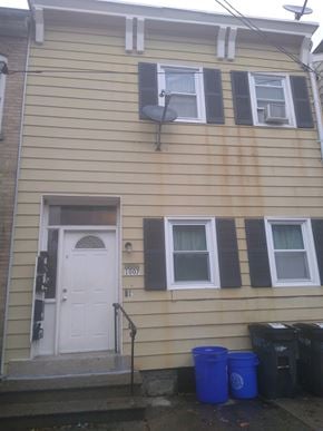 Easton apartment for rent - A house with a white door and two windows with black shutters.