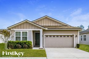 Fernandina Beach house for rent - A house with a garage and a driveway in front of it.