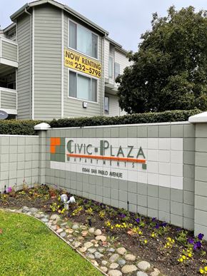 El Cerrito apartment for rent - A building with a sign that says "Civic Plaza" and a phone number.