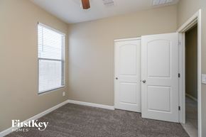 San Tan Valley house for rent - a bedroom with a closet and two doors and a window