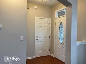 Charlotte house for rent - a hallway with a white door and a window