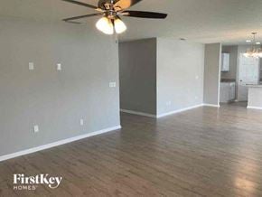 Middleburg house for rent - an empty living room with a ceiling fan