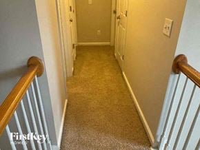 Kennesaw house for rent - a hallway with a stairs and a door