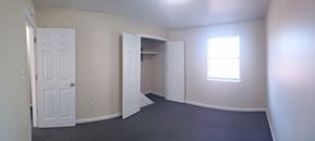 Hattiesburg apartment for rent - A room with a door, a window, and a closet.