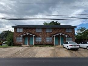 Hattiesburg apartment for rent - A house with a car parked in front.