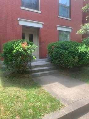 Louisville apartment for rent - a red brick house with stairs in front of it