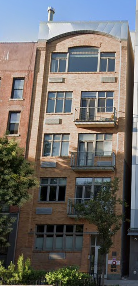 New York apartment for rent - a tall brick building with many windows on it