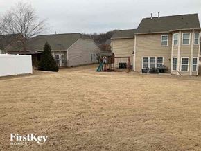 Concord house for rent - a backyard of a house with a yard and a playground