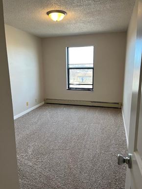 Wahpeton apartment for rent - A room with a carpeted floor and a window.