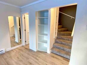 Anchorage apartment for rent - a walk in closet with shelves and stairs in a renovated room