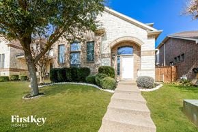 Grand Prairie house for rent - A house with a white door and a tree in front of it.