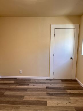 Ontario apartment for rent - the living room with the door open to the dining room