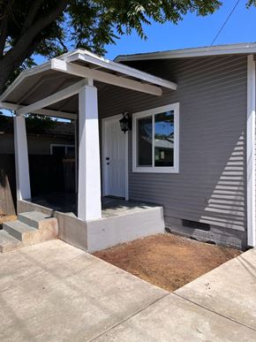 Ontario apartment for rent - a view of the front porch of a grey house