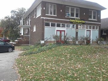 Louisville apartment for rent - a building with a sign on the front of it