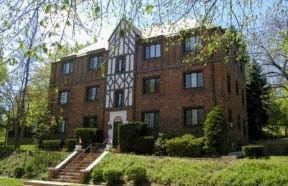 Pittsburgh apartment for rent - a large brick building with a staircase in front of it