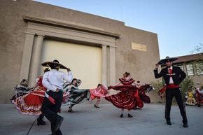 Ajo apartment for rent - a group of people costumes dancing on the street