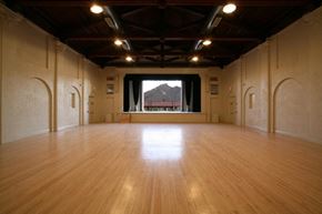 Ajo apartment for rent - an empty room with a wooden floor and a large window