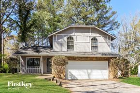 Stone Mountain house for rent - a white house with a white garage door