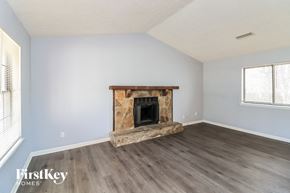 Stone Mountain house for rent - the living room of an empty house with a fireplace