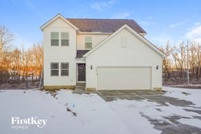 Lancaster house for rent - a white house with a garage in the snow