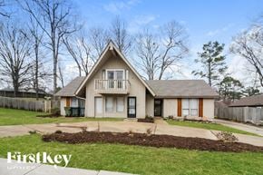 Memphis house for rent - A house with a brown roof and a white door is shown.