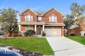 San Antonio house for rent - a brick house with a white sidewalk in front of it