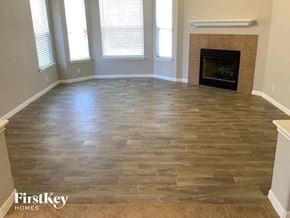 San Antonio house for rent - a living room with a wood floor and a fireplace