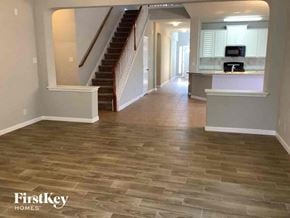 San Antonio house for rent - a living room with a hard wood floor and a staircase