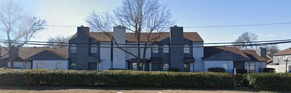 Dallas apartment for rent - a large house with a fence in front of it