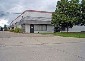 Canton apartment for rent - a white building with a red roof next to a street