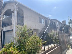 San Diego apartment for rent - the front of a house with stairs and a fence