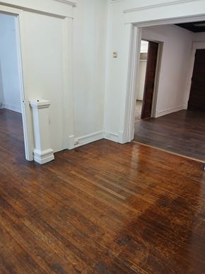 Louisville apartment for rent - A room with a wooden floor and white walls.