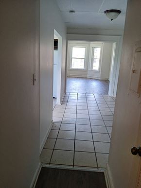 Louisville apartment for rent - an empty room with a tiled floor and a window