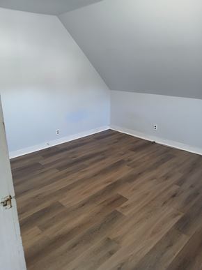 Louisville apartment for rent - A room with wooden flooring and white walls.