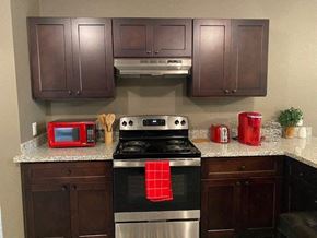 Prairie View apartment for rent - a kitchen with stainless steel appliances and a granite counter top
