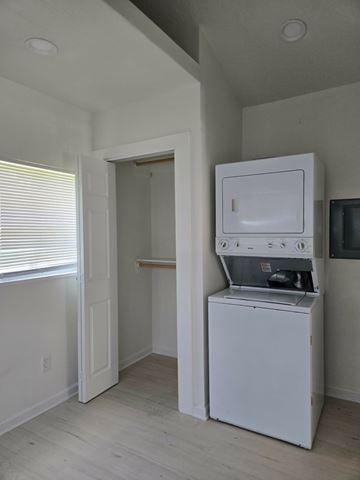 Hattiesburg apartment for rent - A white oven and microwave in a kitchen.