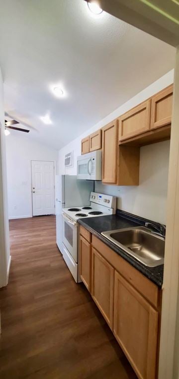 Hattiesburg apartment for rent - A kitchen with wooden cabinets and a stove top oven.