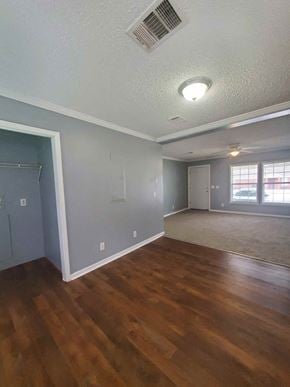 Hattiesburg apartment for rent - an empty living room with a hard wood floor