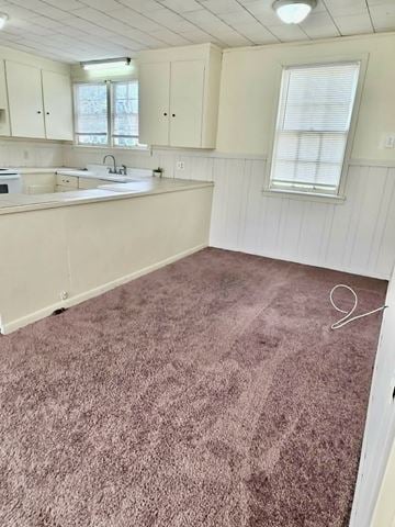 Hattiesburg apartment for rent - A kitchen with white cabinets and a sink.