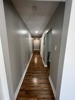 Hattiesburg house for rent - a hallway with wooden floors and grey walls and a white ceiling