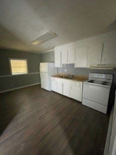 Hattiesburg apartment for rent - A kitchen with white appliances and wooden floors.