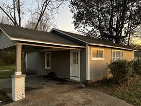 Petal house for rent - a home with a covered porch and a driveway