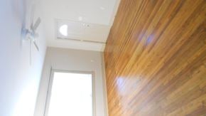 Hattiesburg house for rent - a view of the ceiling of a room with wood flooring and a window
