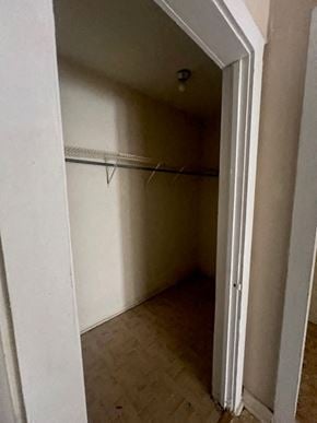 Hattiesburg house for rent - A white door is open to a small, empty room with a shelf.