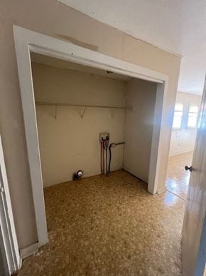 Hattiesburg house for rent - A room with a carpeted floor and a white door.
