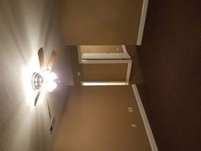 Purvis apartment for rent - a room with a fan and a printer on a wall
